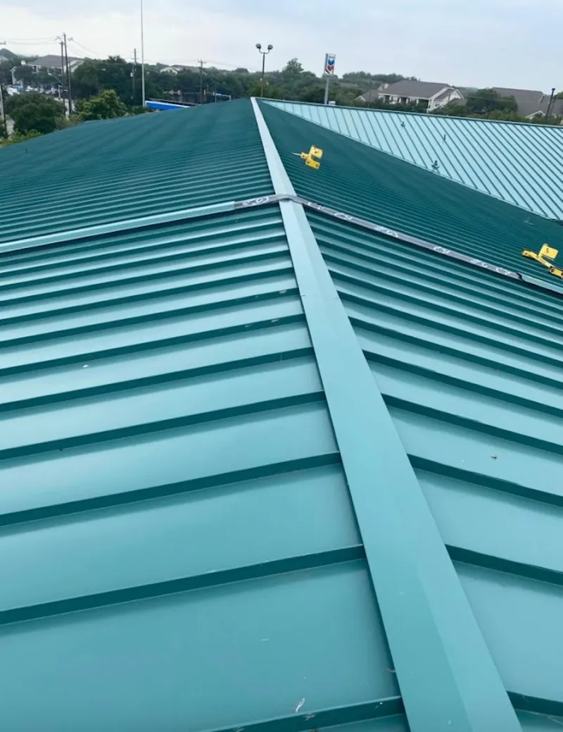 Green commercial metal roof ridge and valley for Metal Roof Repair in Cherry Creek